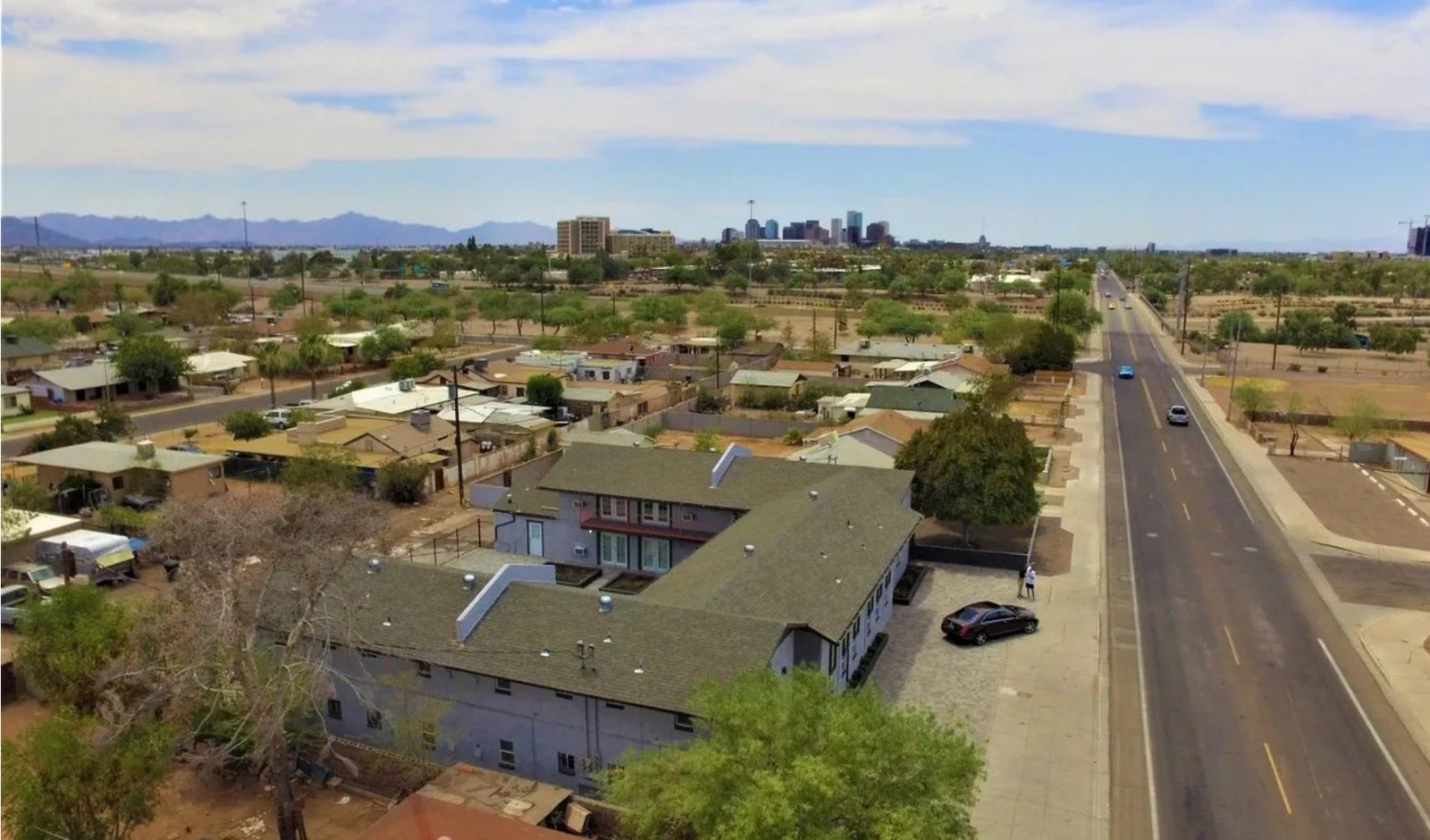 Aerial view of Lucky Star Flats apartments with downtown Phoenix skyline in the background