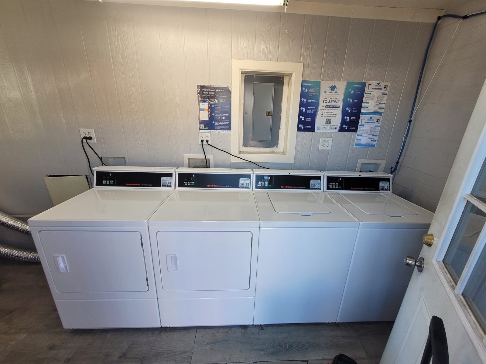 On-site laundry room with Speed Queen washers and dryers at Lucky Star Flats